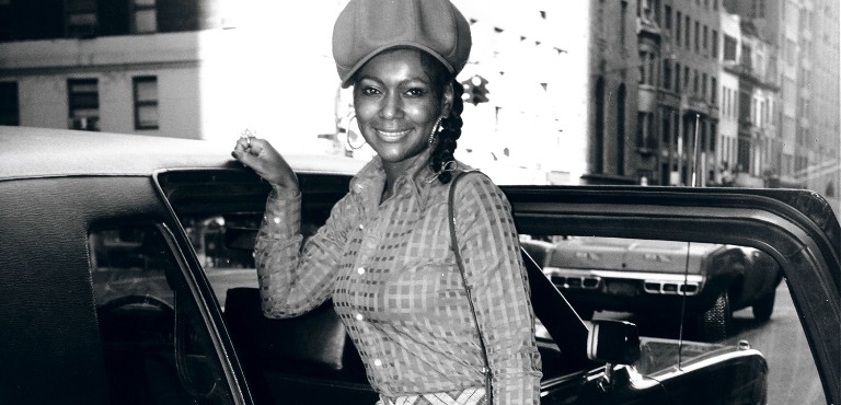 Sylvia Robinson poses next to a car in the 70s